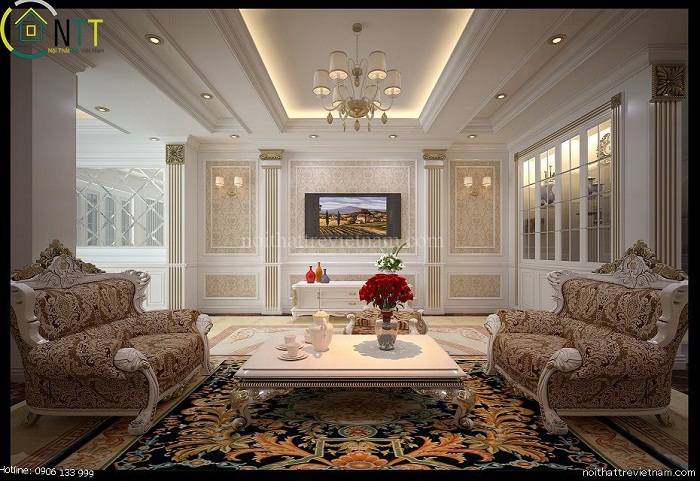 ​Phòng khách được trang trí trần thạch cao cùng đèn hắt ánh sáng vàng 